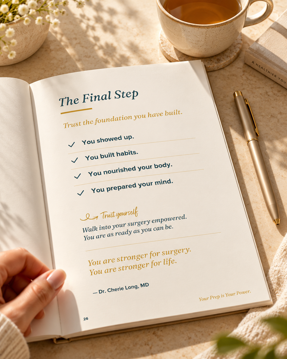 The READY Guide open on a table, a hand turning the page